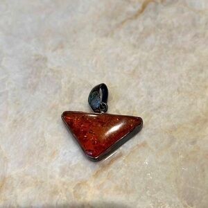 Vintage baltic amber pendant. Silver backing.